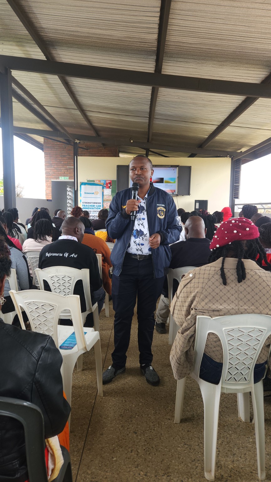 Daniel Kamau facilitating educators in a large-group session