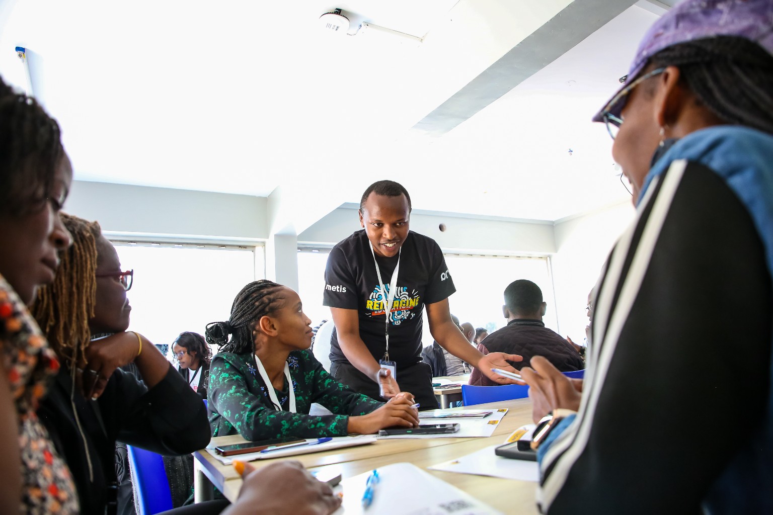 Daniel Kamau facilitating educators in a small-group workshop
