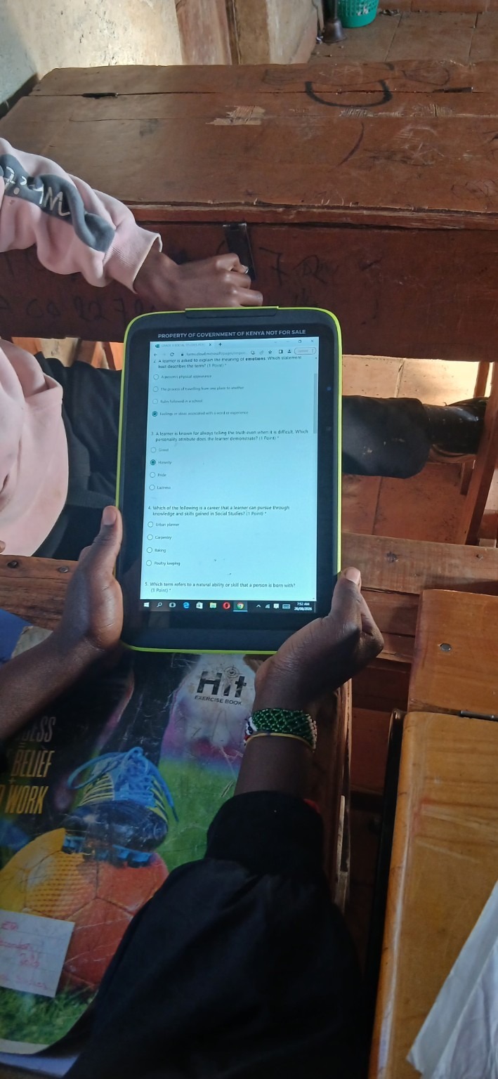 Learner using a government-issued digital tablet for learning