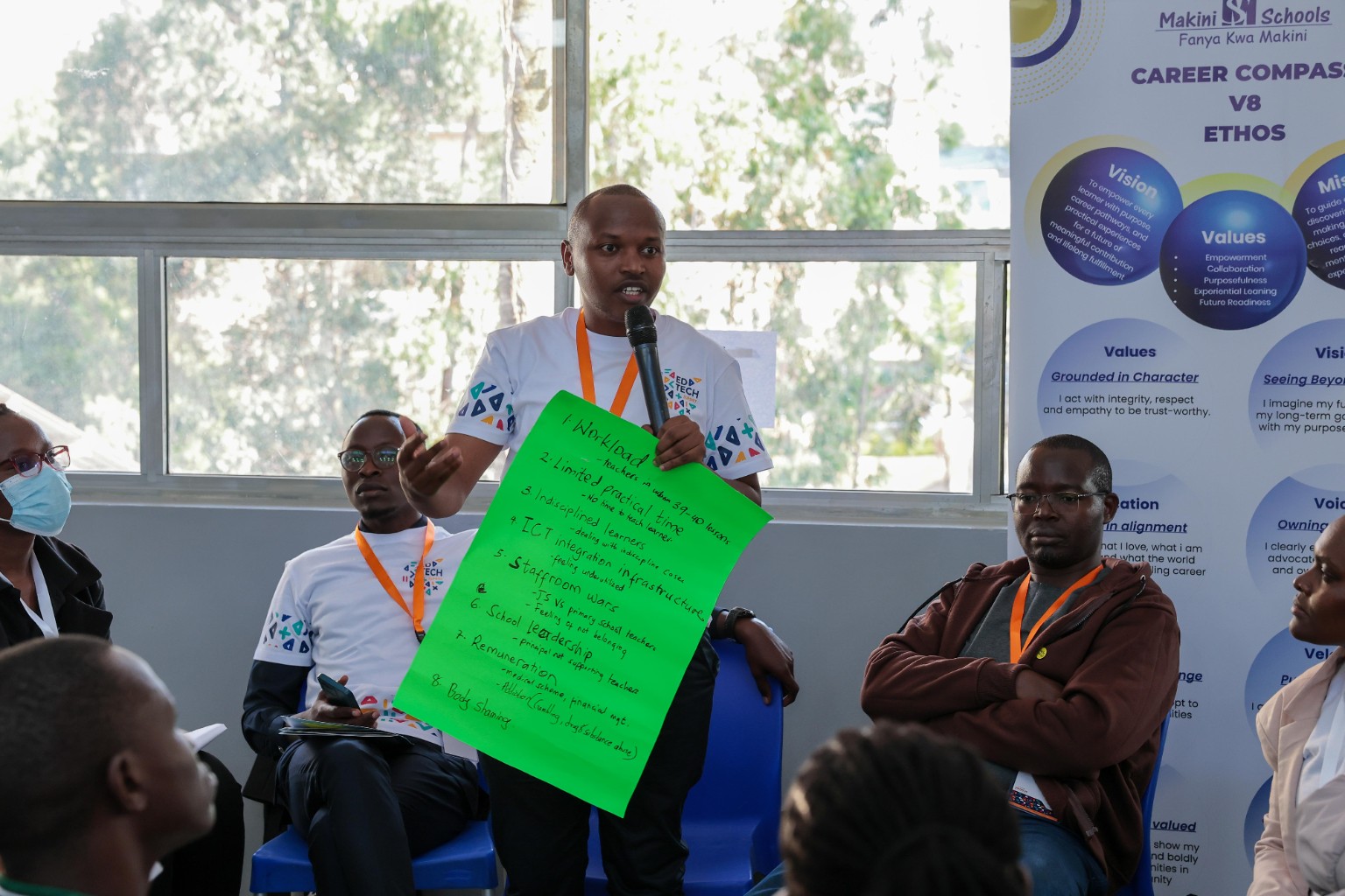 Daniel Kamau advocating for teacher wellness during an education session